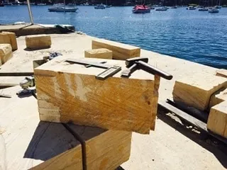Cut sandstone blocks prepared for harbour wall restoration