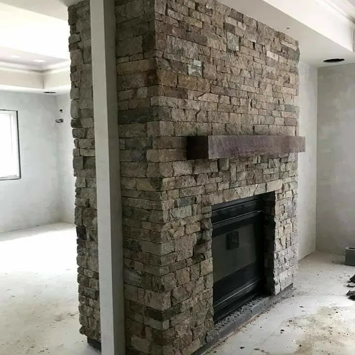 Stunning stone veneer fireplace surround in living room