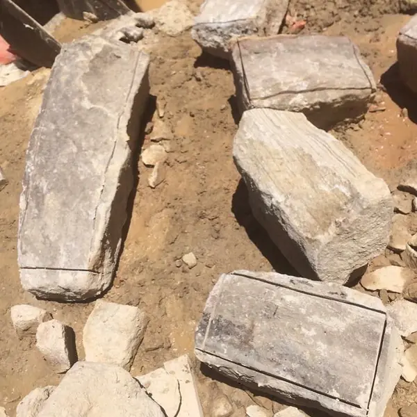 Ornate heritage stone capital being restored in workshop
