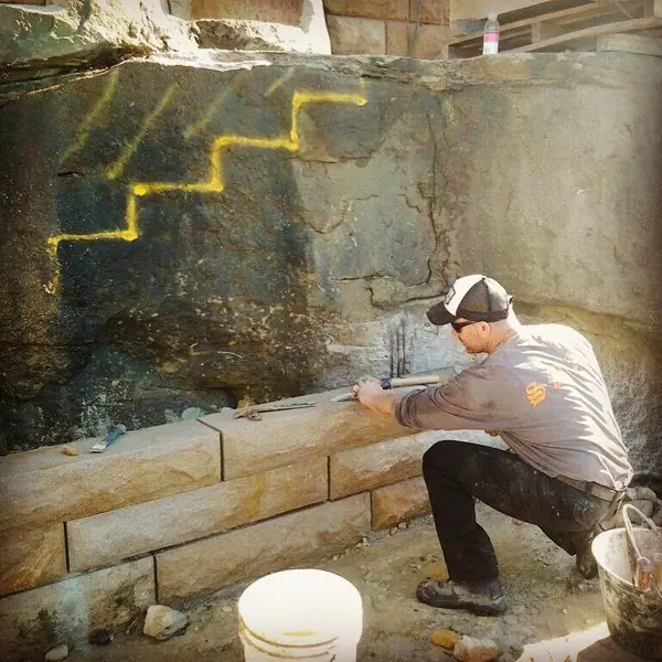 Heritage sandstone block wall with weathered patina