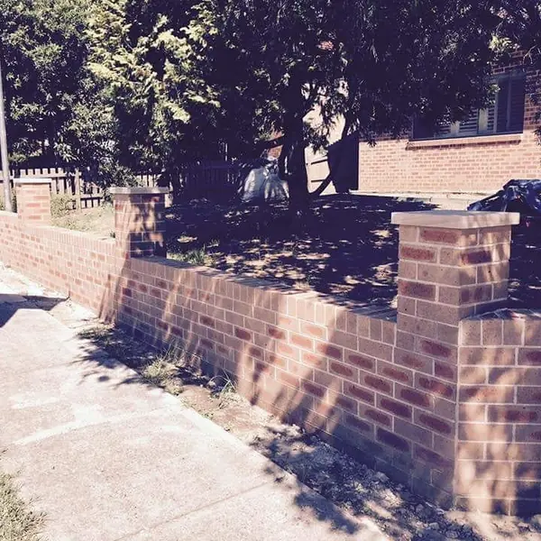 Heritage sandstone wall restoration with new blocks