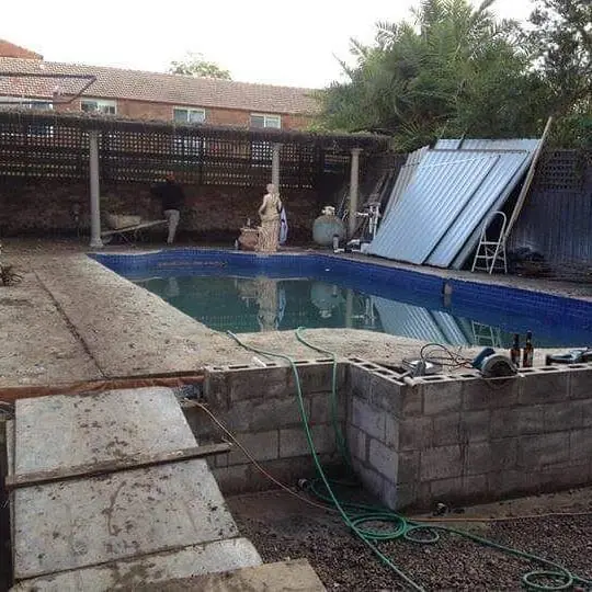 Concrete demolition work in residential courtyard