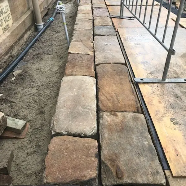 Sandstone block paving along heritage waterfront walkway