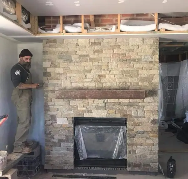 Minas building natural stone fireplace surround on-site
