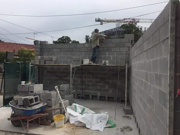 Urban construction site with block retaining wall
