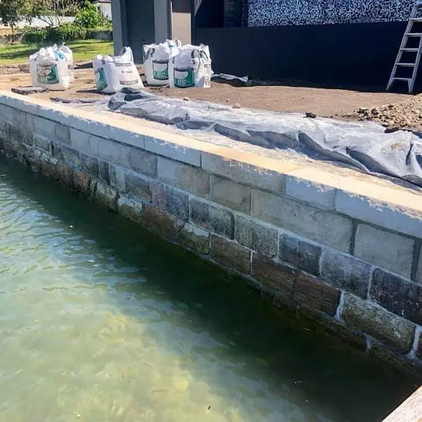 Heritage sandstone seawall blocks placed at waterfront