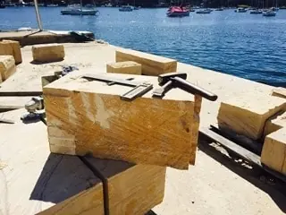 Cut sandstone blocks prepared for harbour wall restoration
