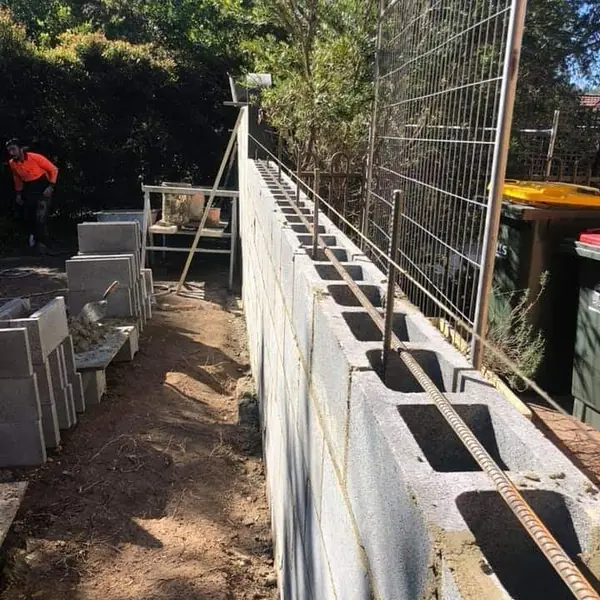 Cement render applied to garden boundary wall