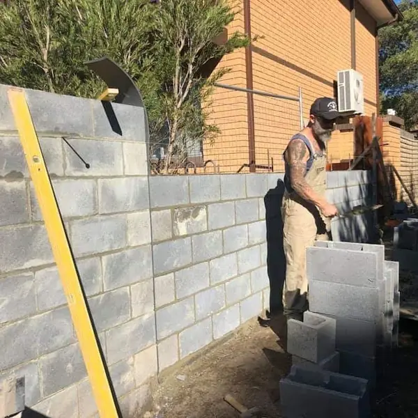 Rendered wall with textured finish in garden setting