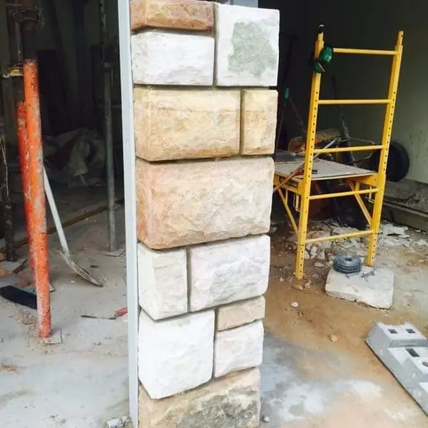 Acrow props and wheelbarrow in stonework repair area