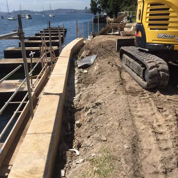 Waterfront property with completed stone retaining wall
