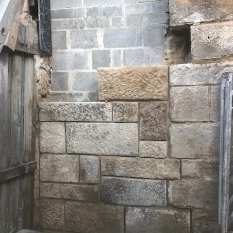 Heritage sandstone wall needing mortar repointing