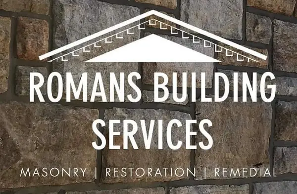 Romans Building Services logo on stone wall background