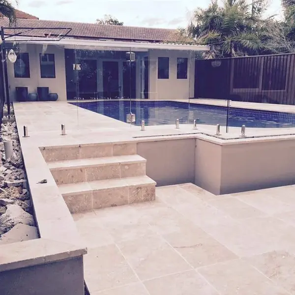 Concrete pool coping and rendered wall completion