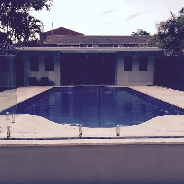 Completed pool surround with rendered retaining walls
