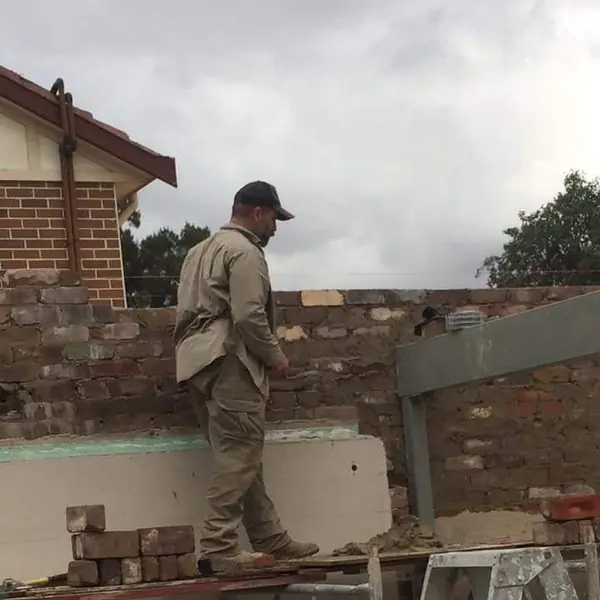 Residential roof and masonry repair work in progress