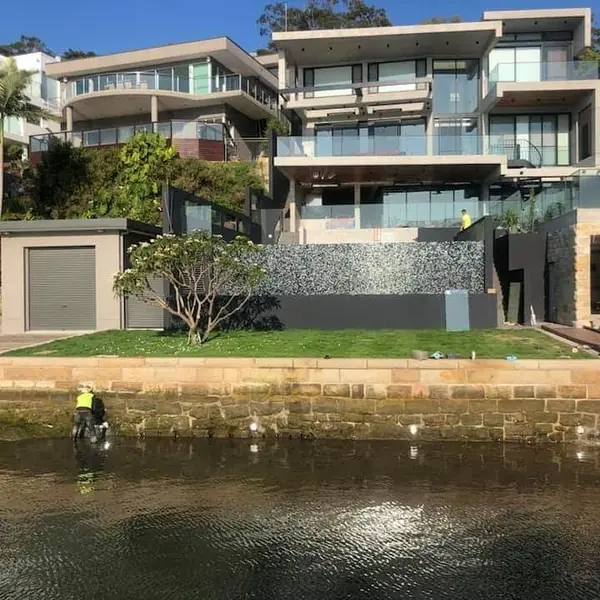 Luxury waterfront property with stone retaining walls