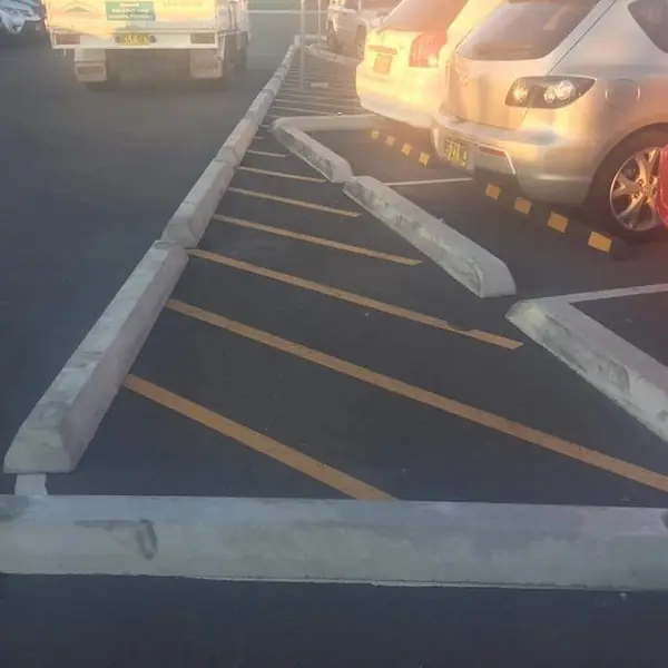 Finished concrete kerbing along commercial driveway
