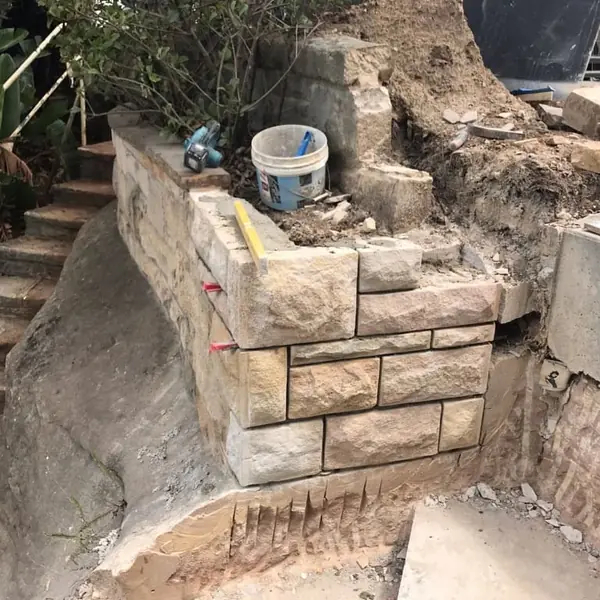 Cut sandstone blocks prepared for wall construction