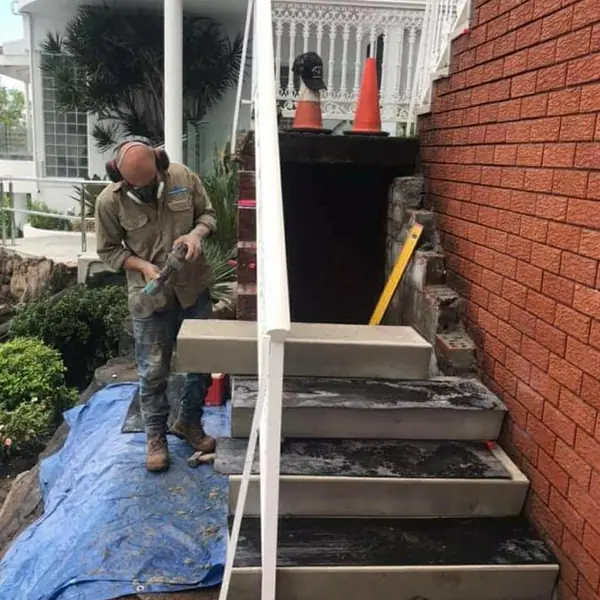 Concrete staircase repair with rendered balustrade detail