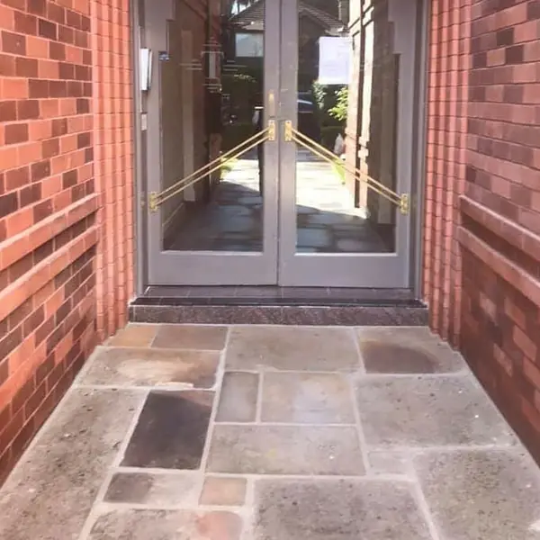 Finished sandstone paving with garden bed edging