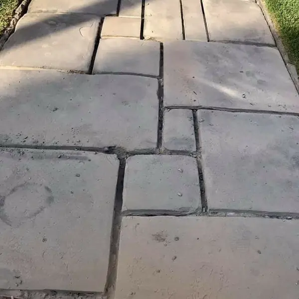 Completed sandstone paving walkway through garden