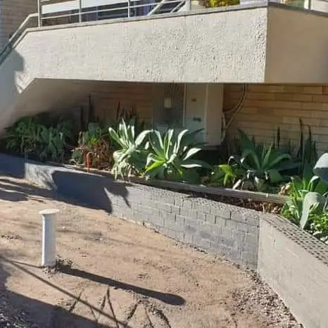 Sandstone flag paving with concrete retaining edge