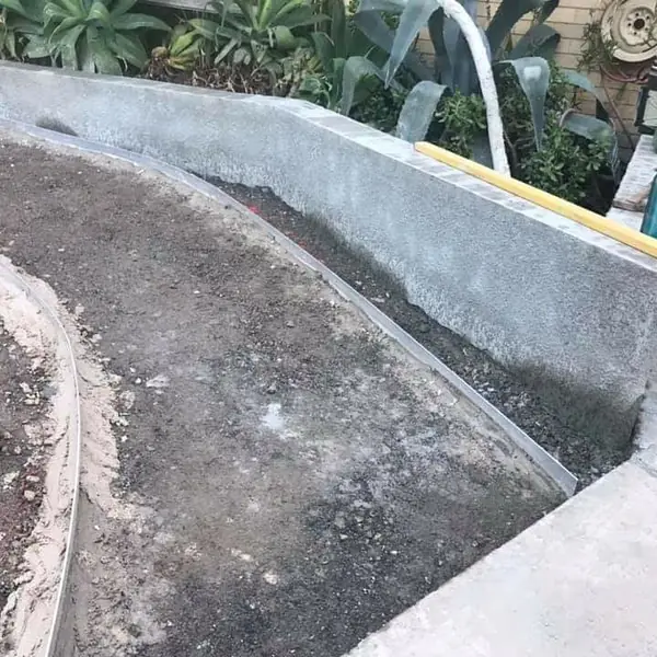 Completed sandstone paving with garden landscaping