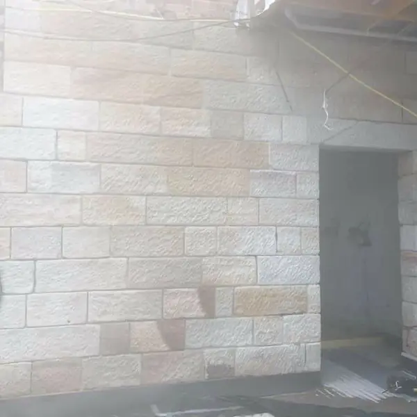 Interior sandstone block wall with split-face finish