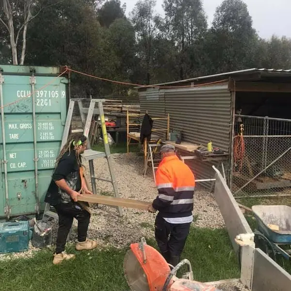 Sandstone slab cutting with power saw on worksite