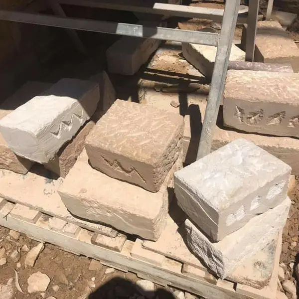 Completed sandstone cladding on retaining wall section