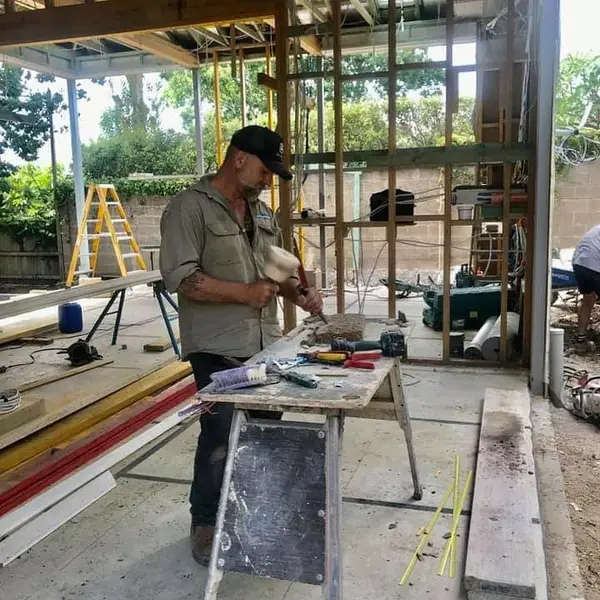 Sandstone block exterior wall nearing completion