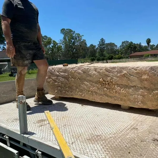 Salvaged sandstone blocks prepared for heritage wall