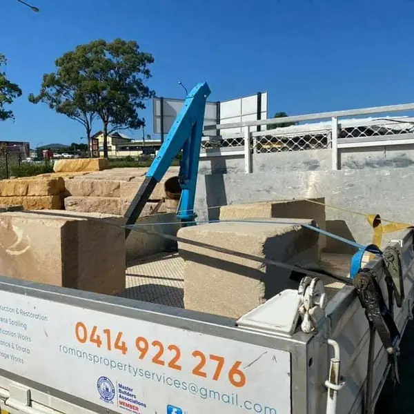 Reclaimed sandstone blocks sorted for restoration project