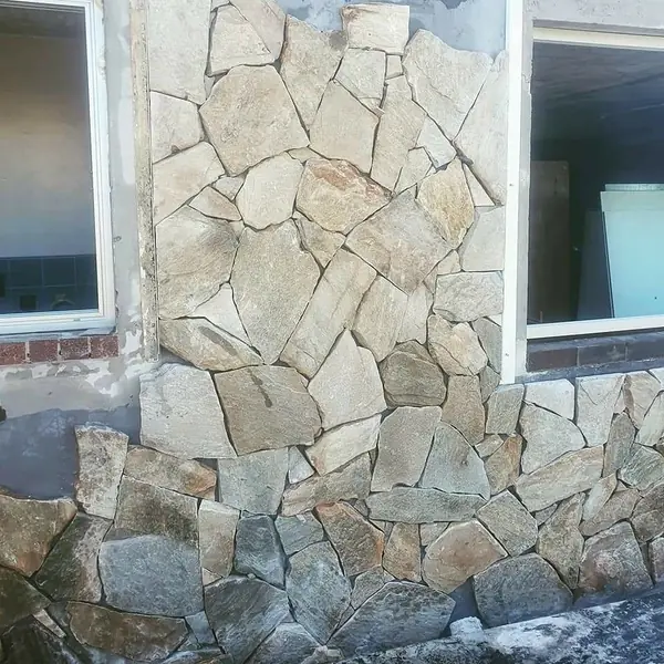 Natural stone cladding detail with irregular pattern