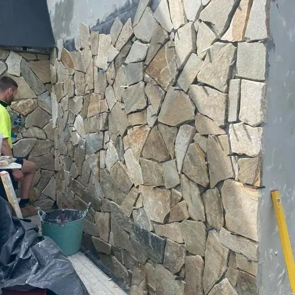 Stone cladding feature wall on residential building facade