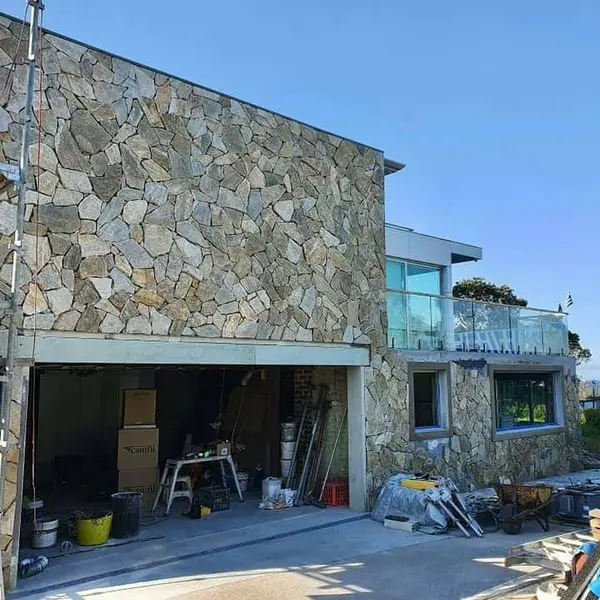 Exterior stone cladding with materials on-site