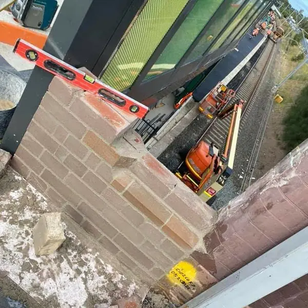 Brickwork repair at height above railway infrastructure