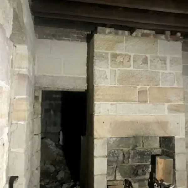 Hand-dressed sandstone interior with pendant lighting