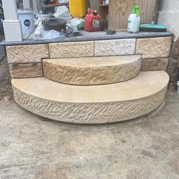 Sandstone arch construction with structural formwork