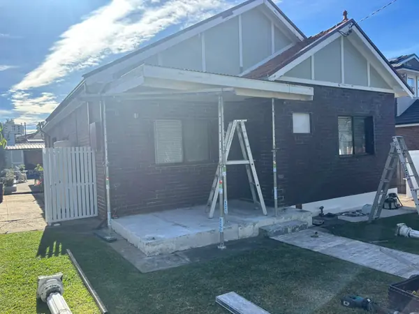 Residential brick building extension with concrete slab