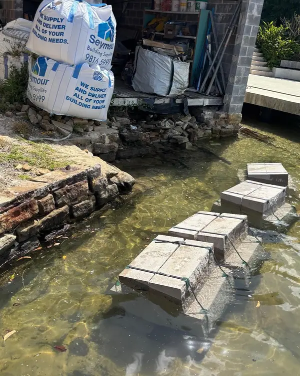Blue stone crazy paving feature wall with spacers curing